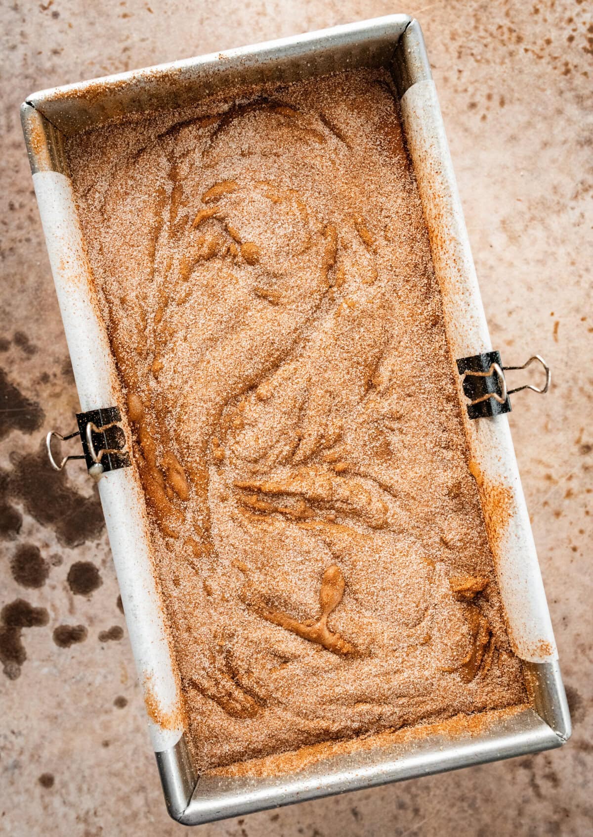 prepared cinnamon swirl batter in baking pan ready for oven.