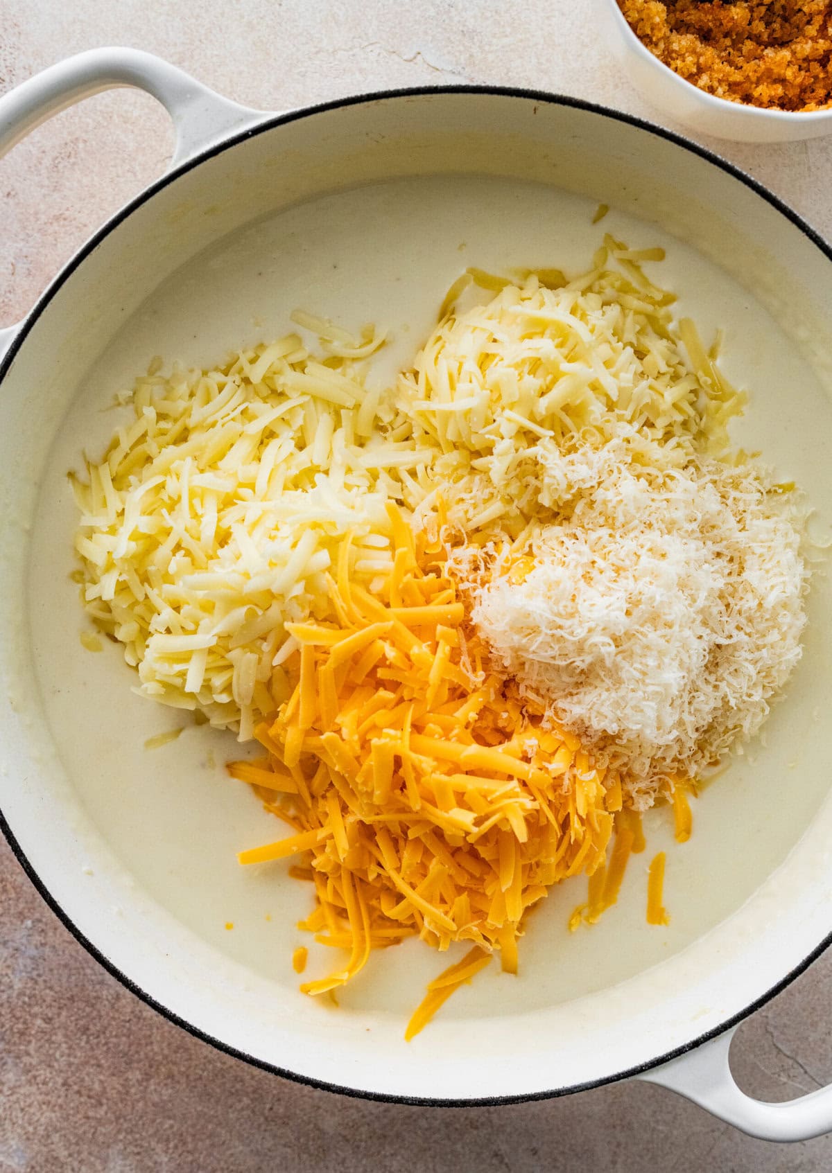add all the cheese to the pan with sauce for the homemade mac and cheese