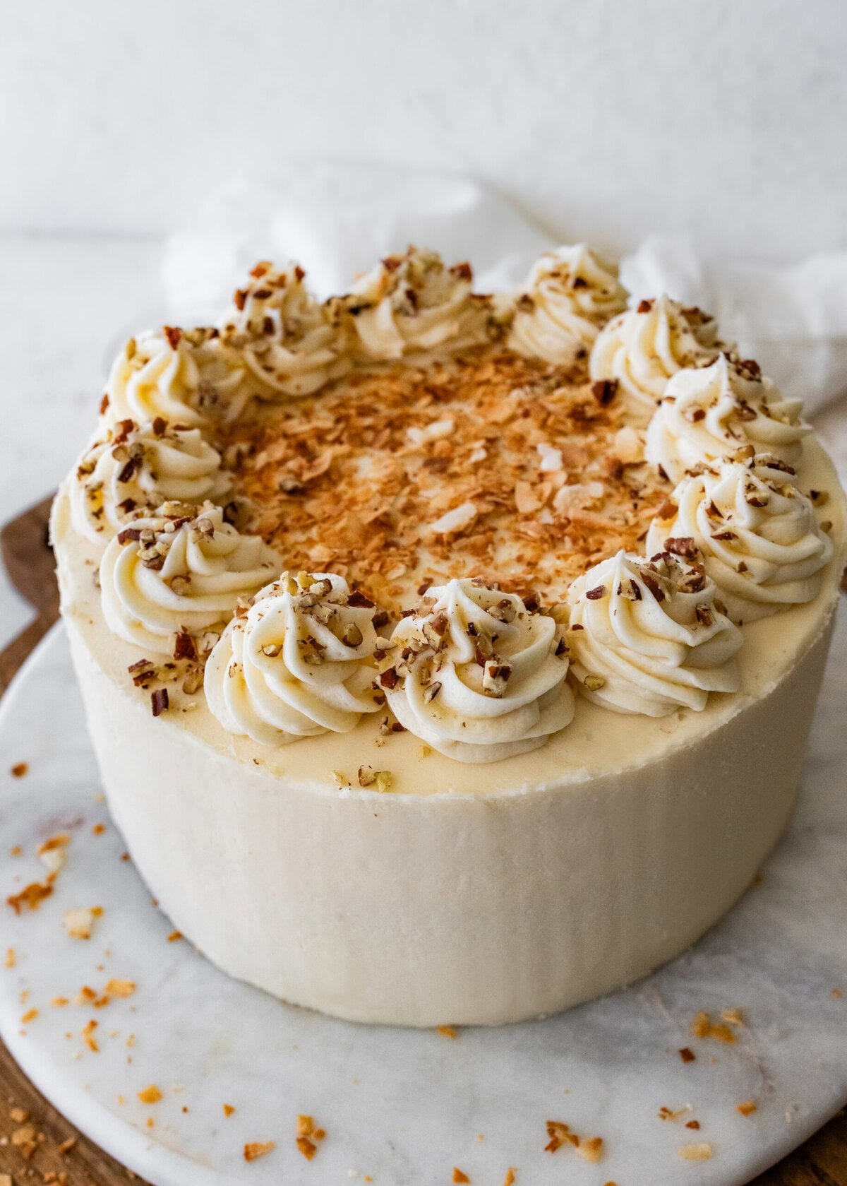 beautiful Italian cream cake on a serving platter.
