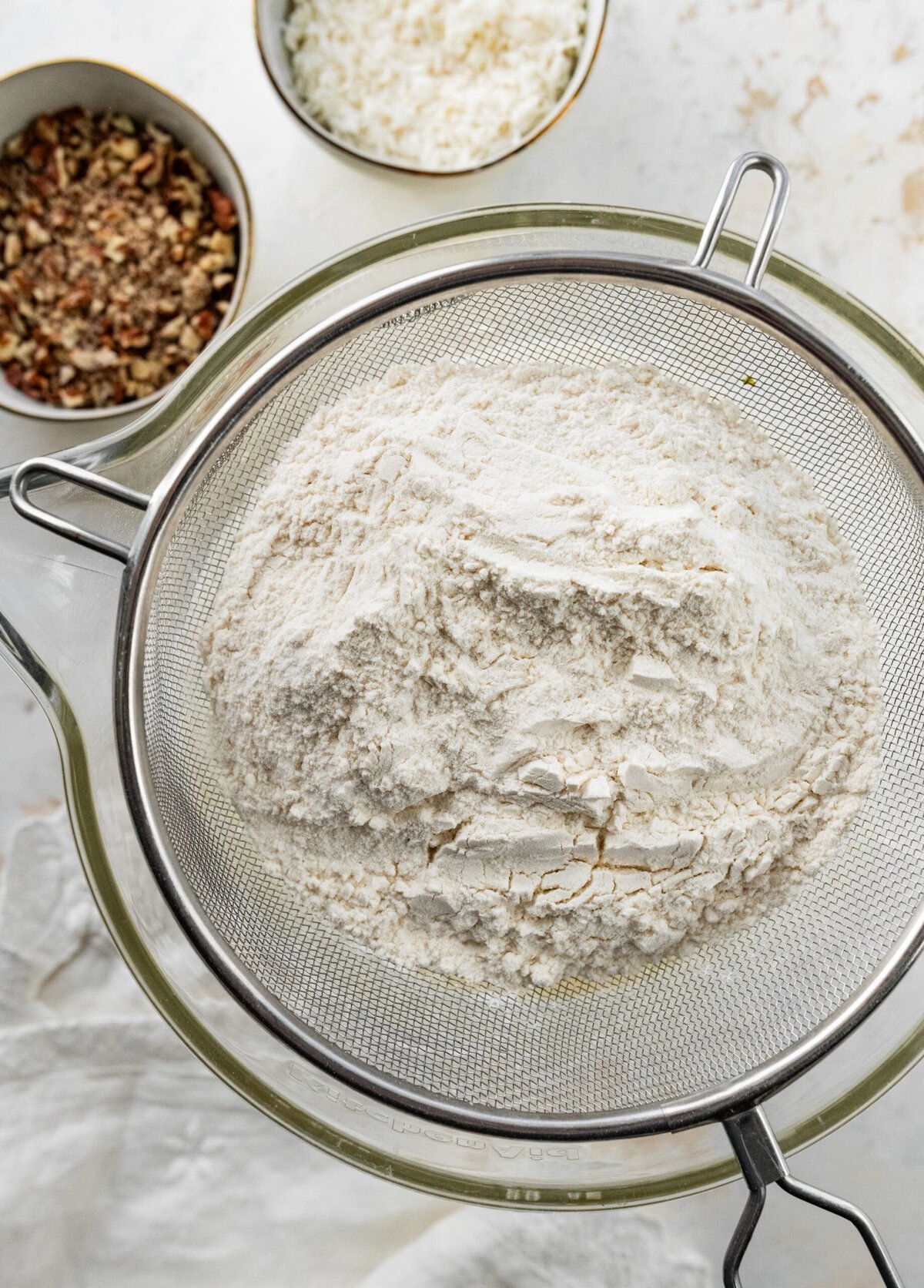 sift the dry ingredients into the bowl with wet ingredients.