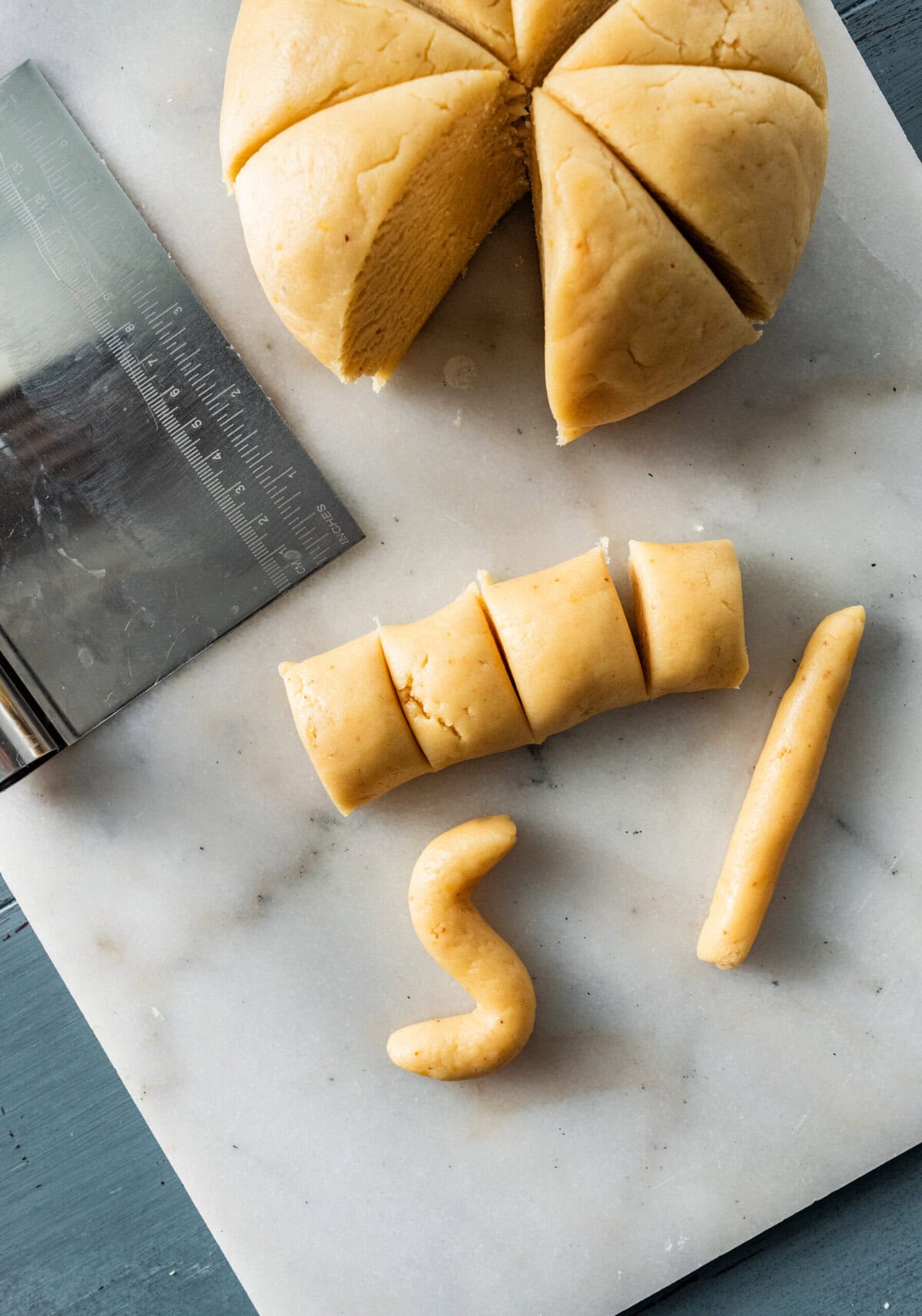 cut the cookie dough into strips and then form into an "s" shape on the counter.