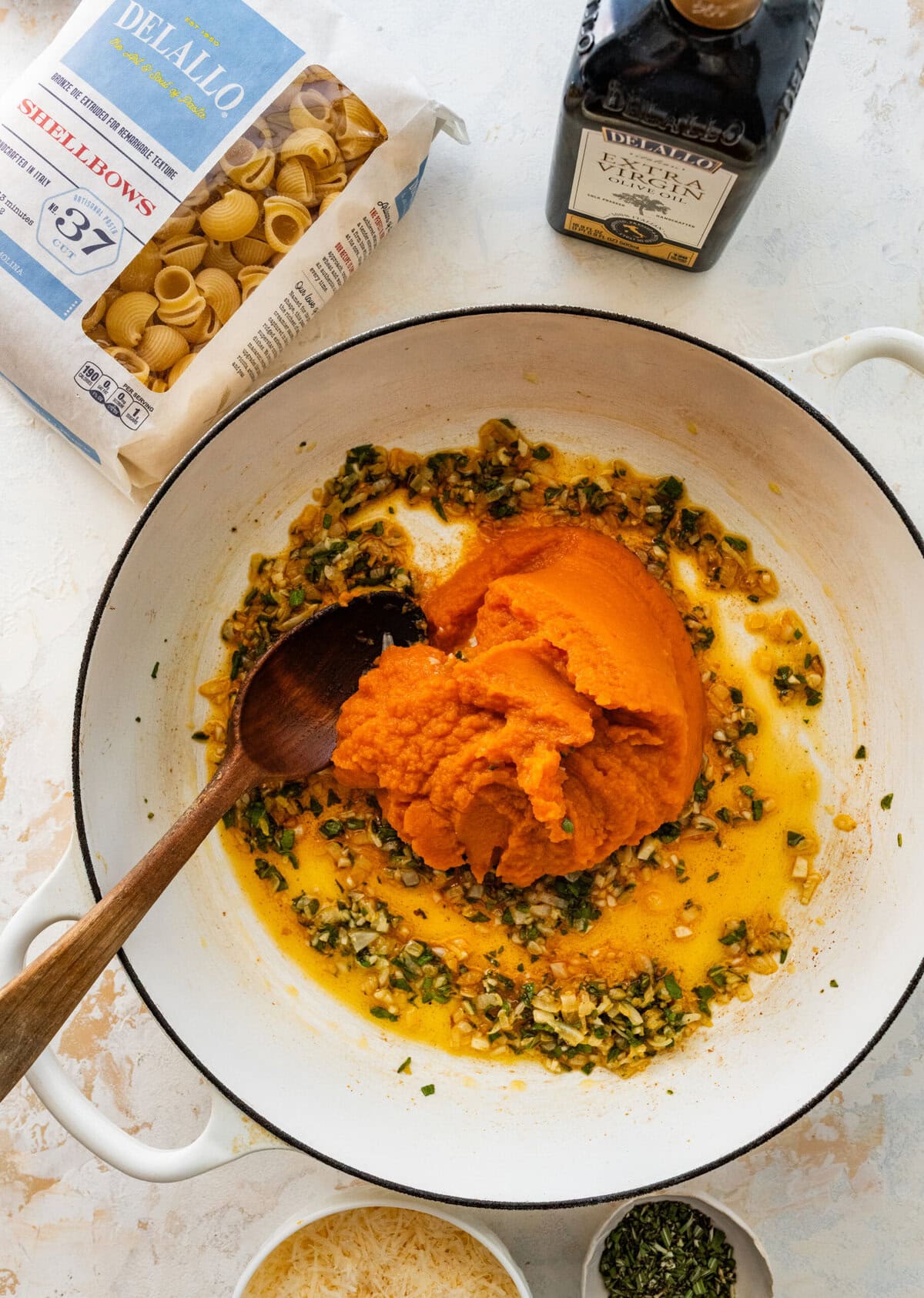 pumpkin in pan with herbs and garlic.