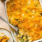 serving spoon with a portion of the chicken broccoli and rice casserole showing delicious layers.