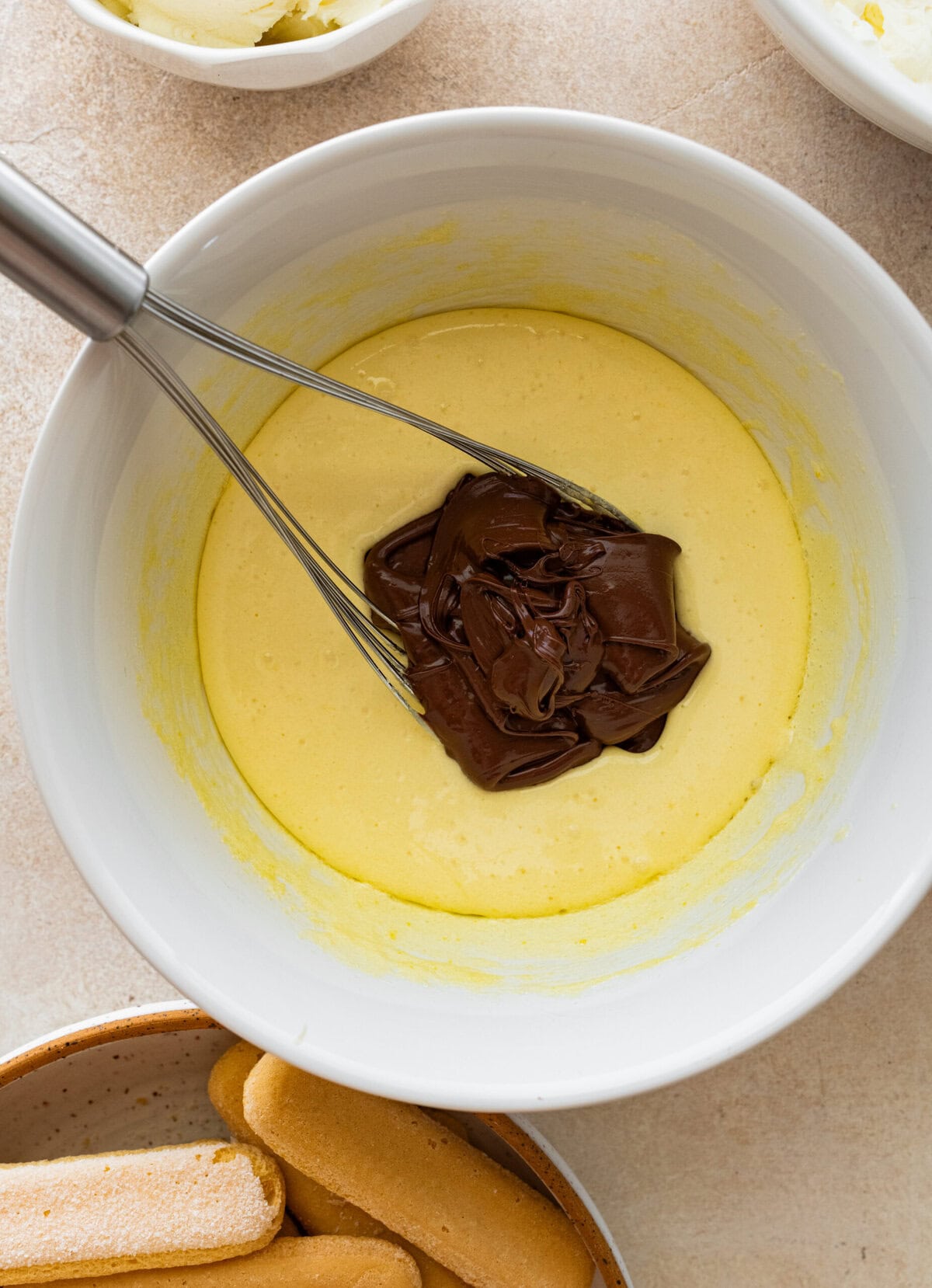 add cooked chocolate custard to egg mixture.