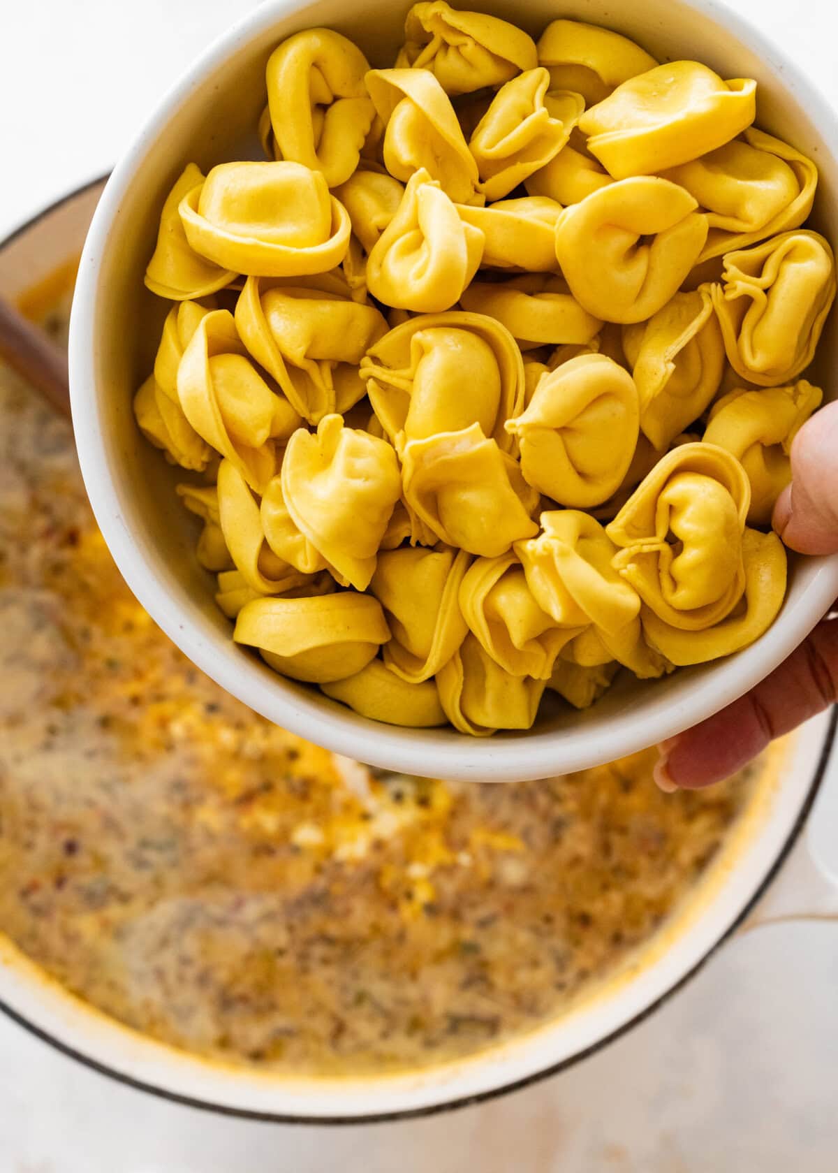 add tortellini to the pot and cook.