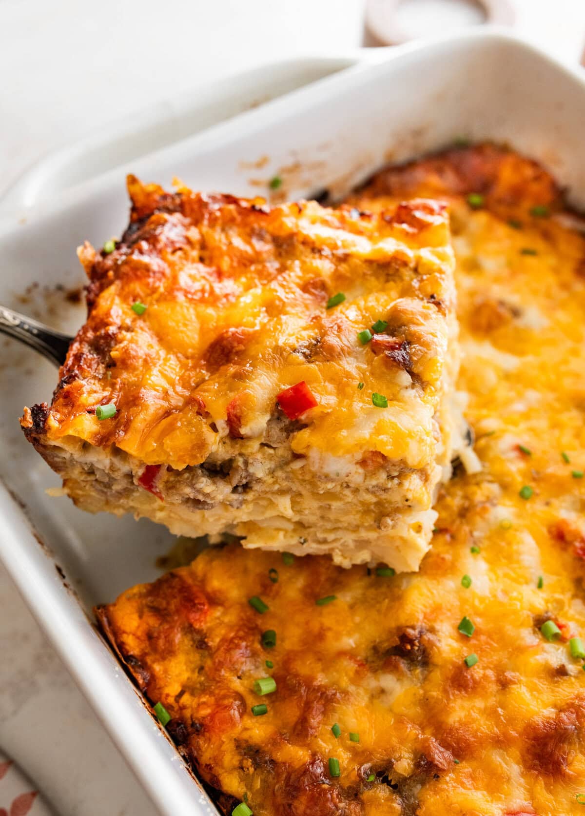spatula lifting a square from the hashbrown breakfast casserole.