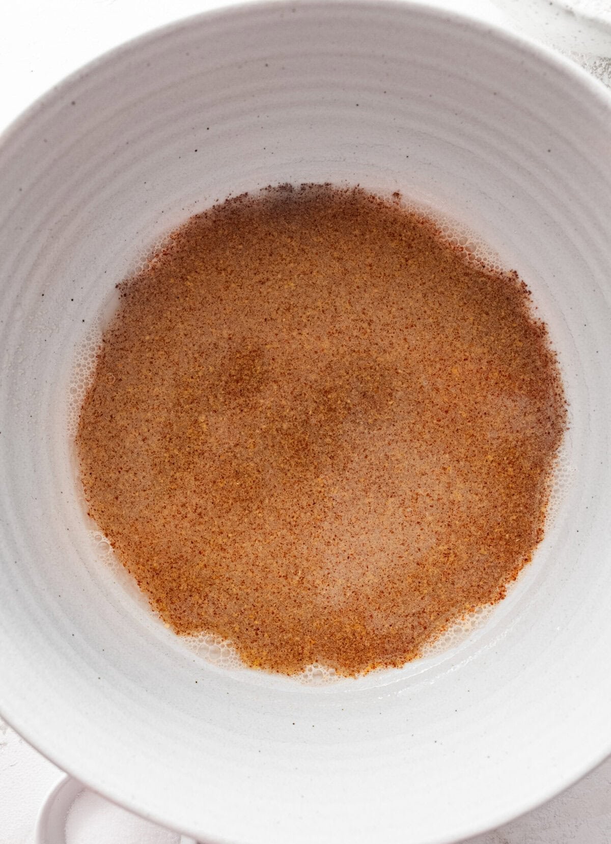 Yeast and water in a bowl. 