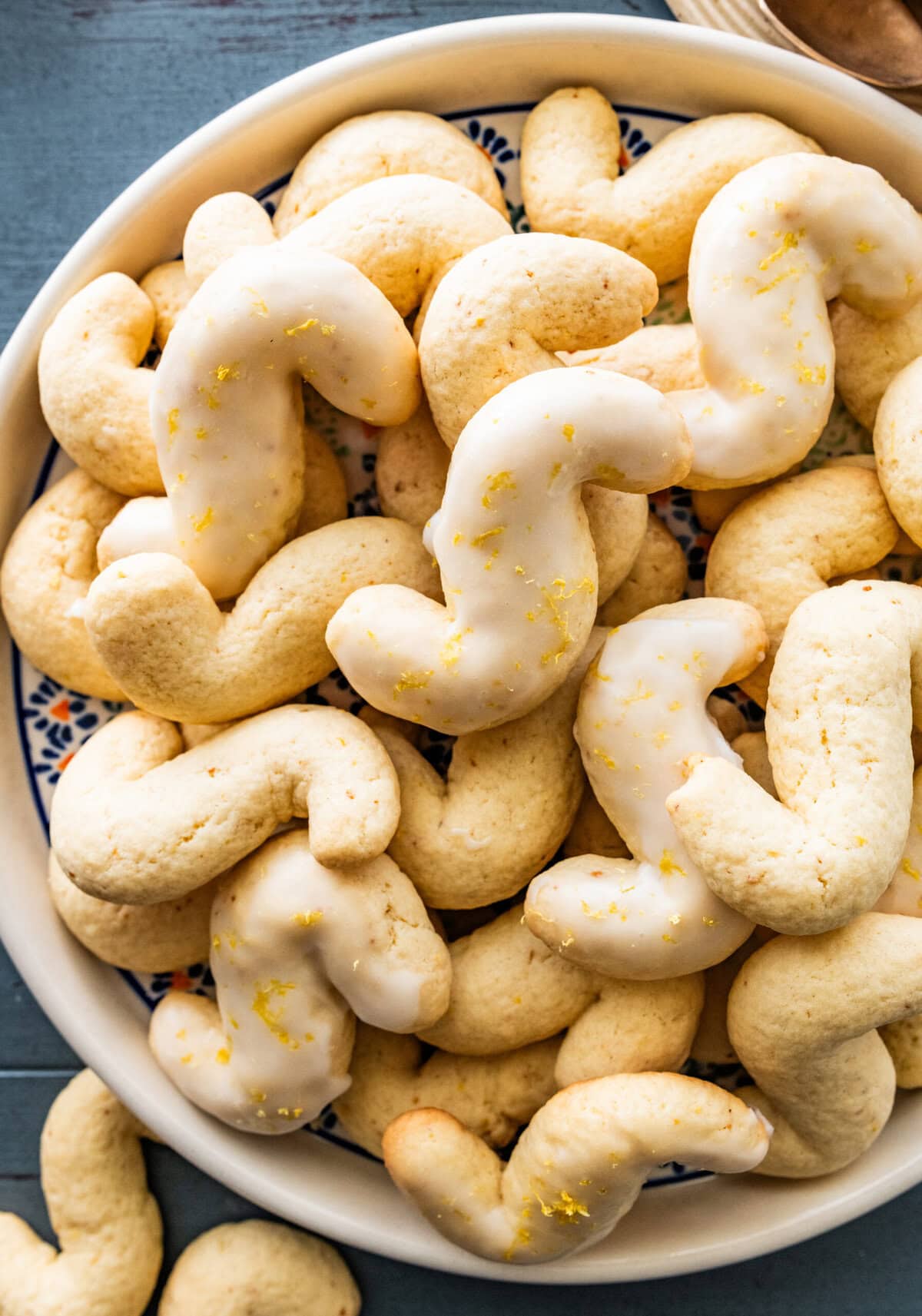 Beautiful Italian tray of Italian S cookies with a cup of tea on the side.