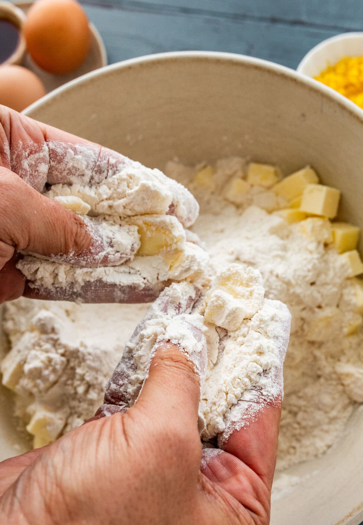 crumble the butter and flour together in a bowl with hands.