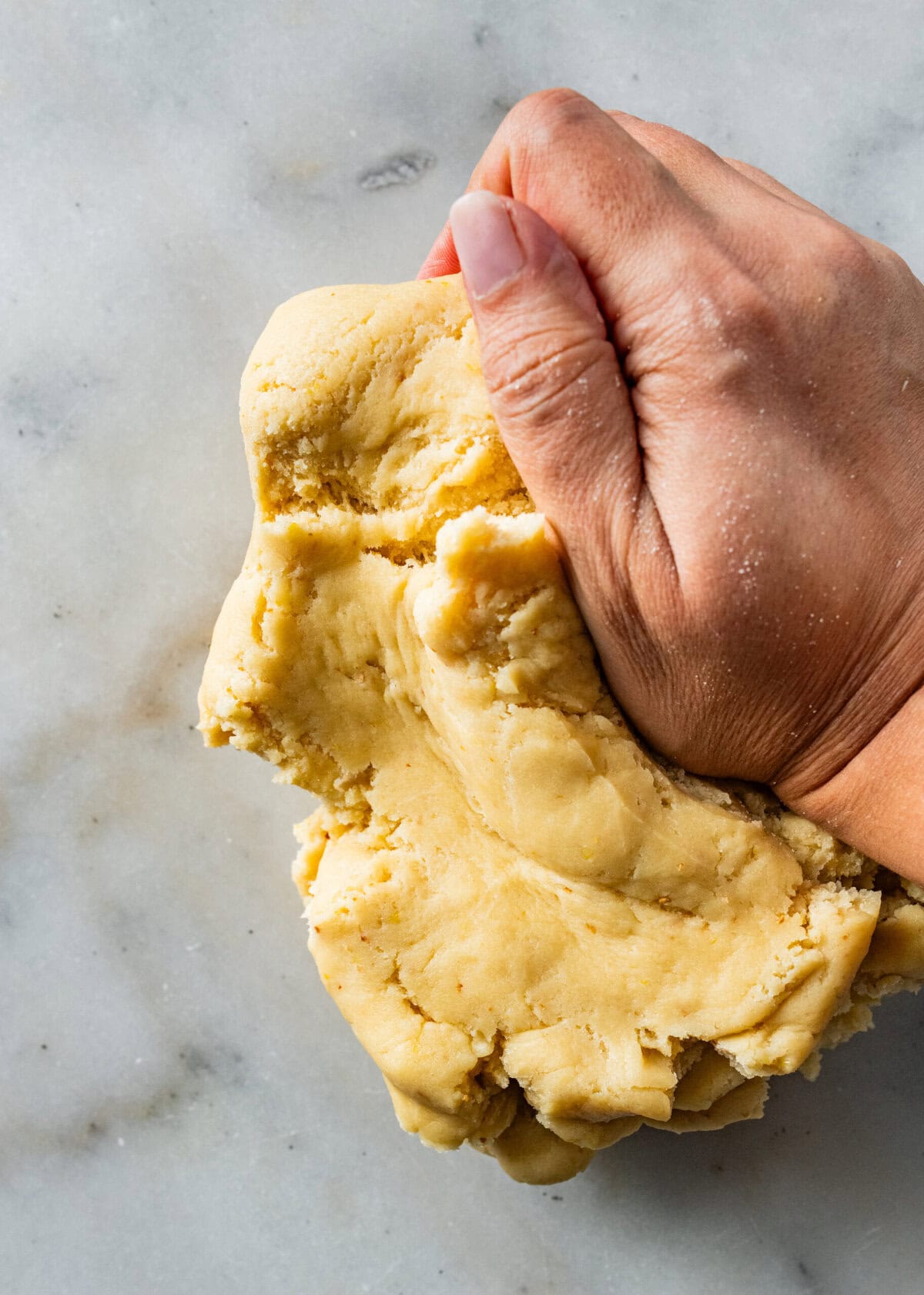 knead the italian S cookie dough on the counter with hands.