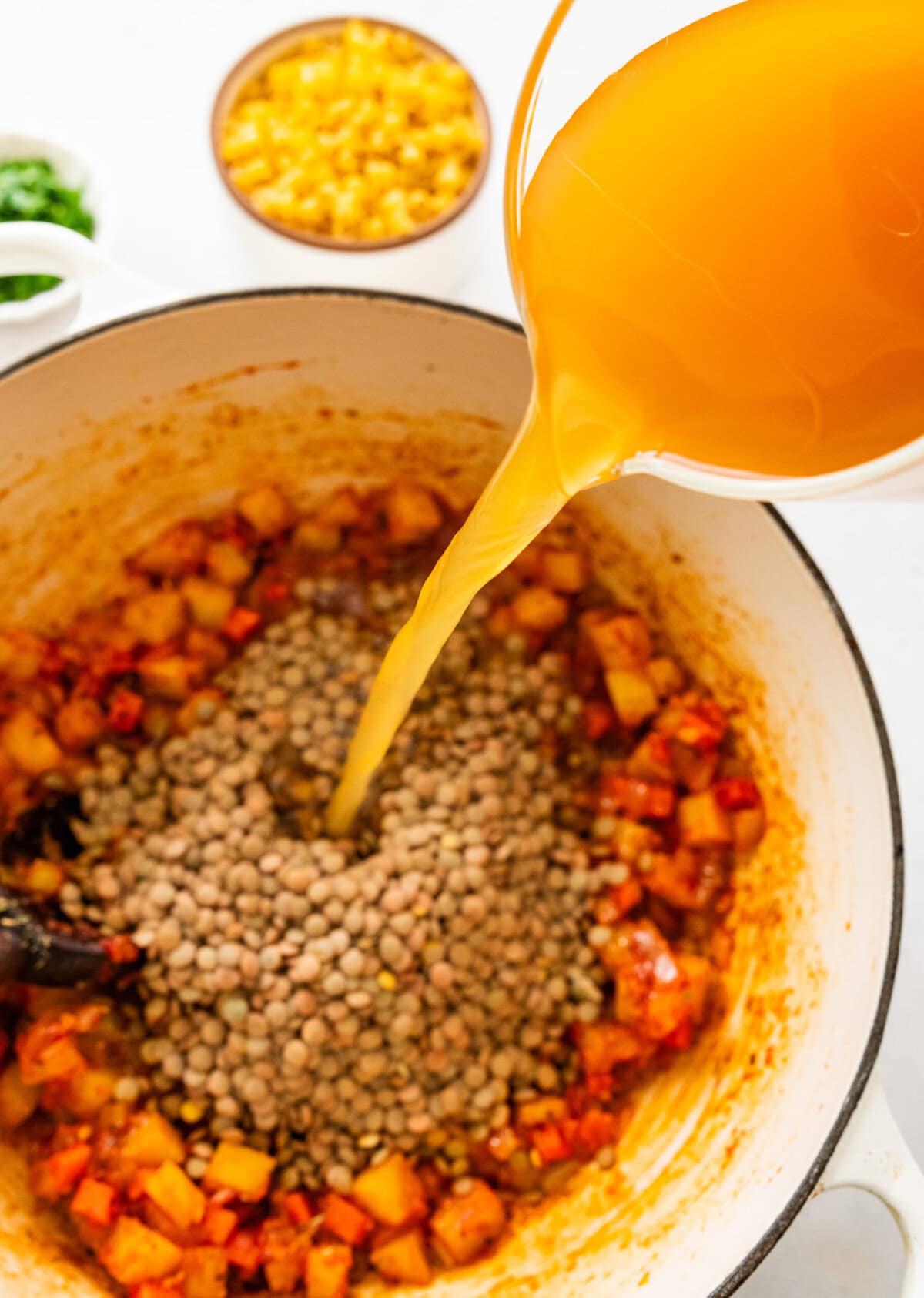 add broth and lentils to pot.