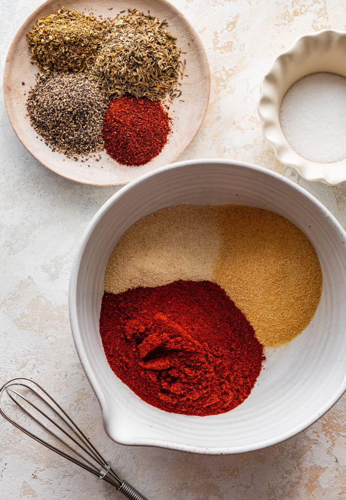 some of the ingredients in a bowl for the seasoning mix.