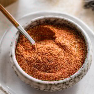 blackened seasoning in a white bowl with a spoon in it.
