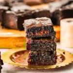 brown butter brownies stacked on a plate ready to eat.