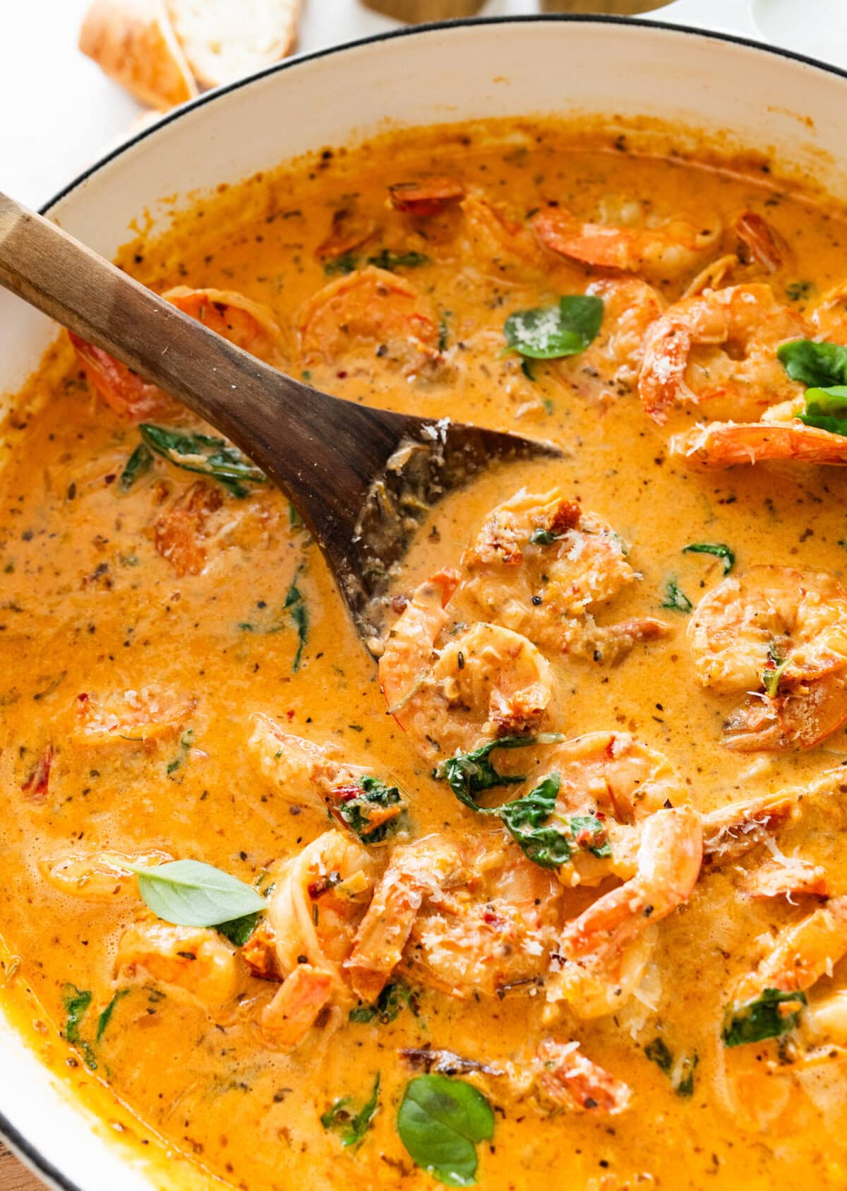 marry me shrimp in pan with wooden spoon ready to serve.