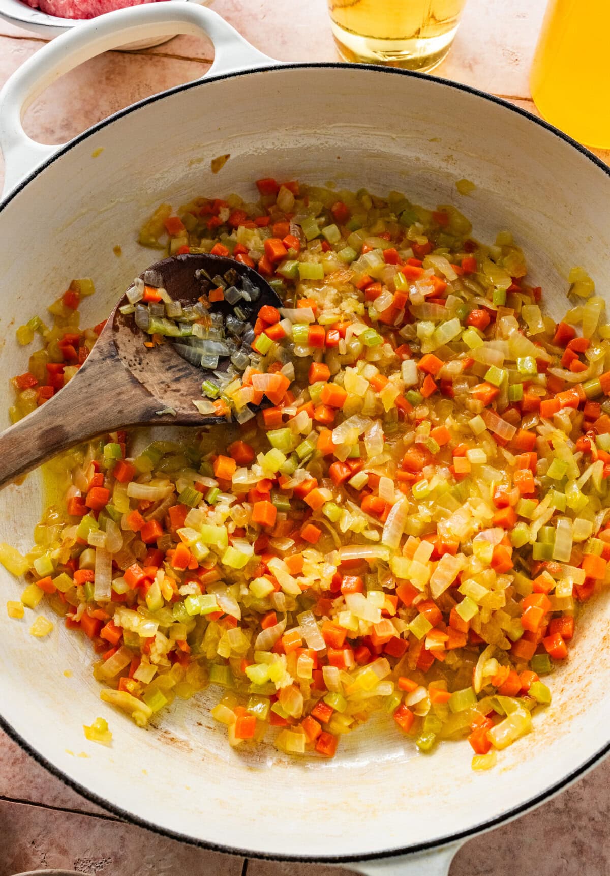 cooked onion, carrot, and celery in a pot.
