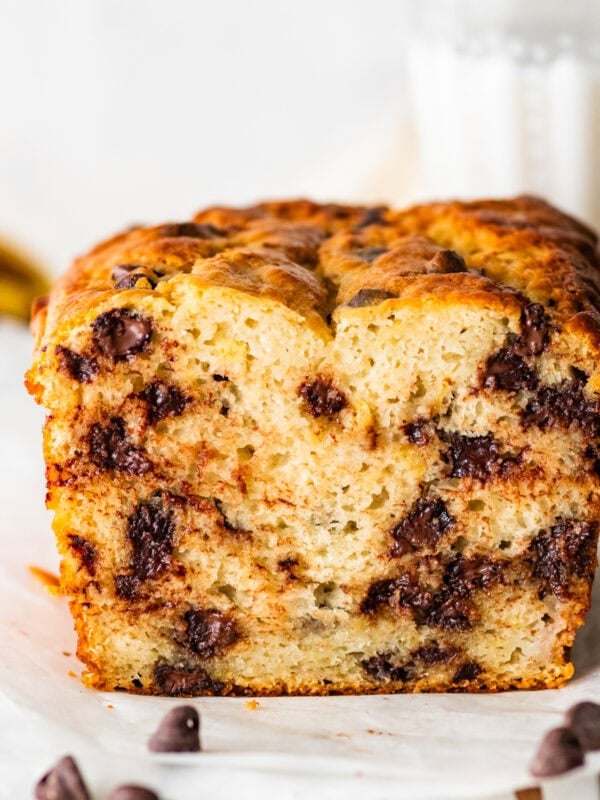 A loaf of chocolate chip banana bread cut in half to show inside of the bread.