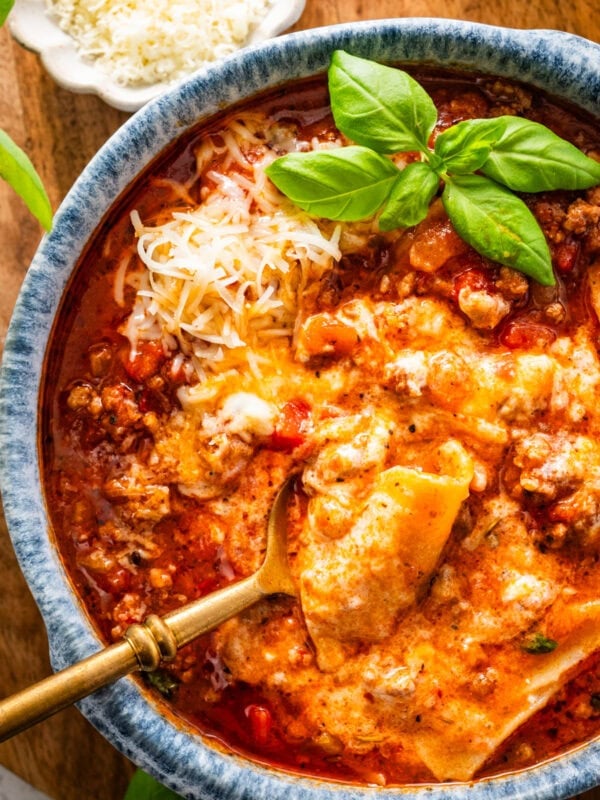 lasagna soup in a bowl with a spoon lifting a bite.