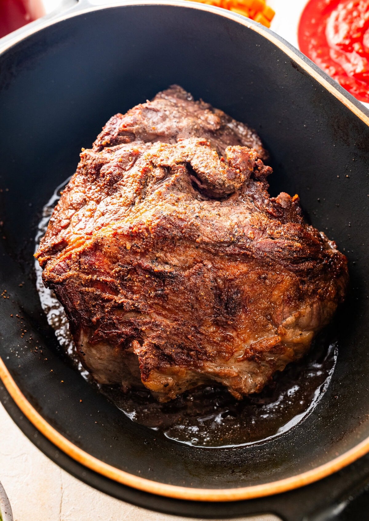 Pot roast in a pot after seared.