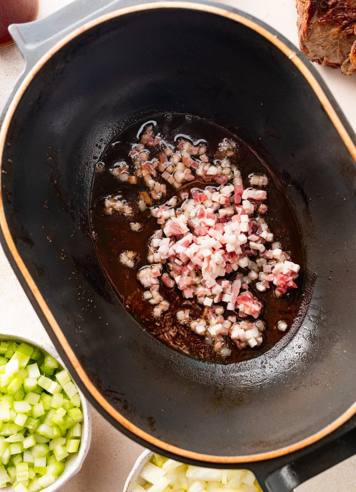 Pot roast removed from the pot, and pancetta added.