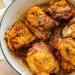 Chicken thighs after cooking halfway and flipped on the pan.