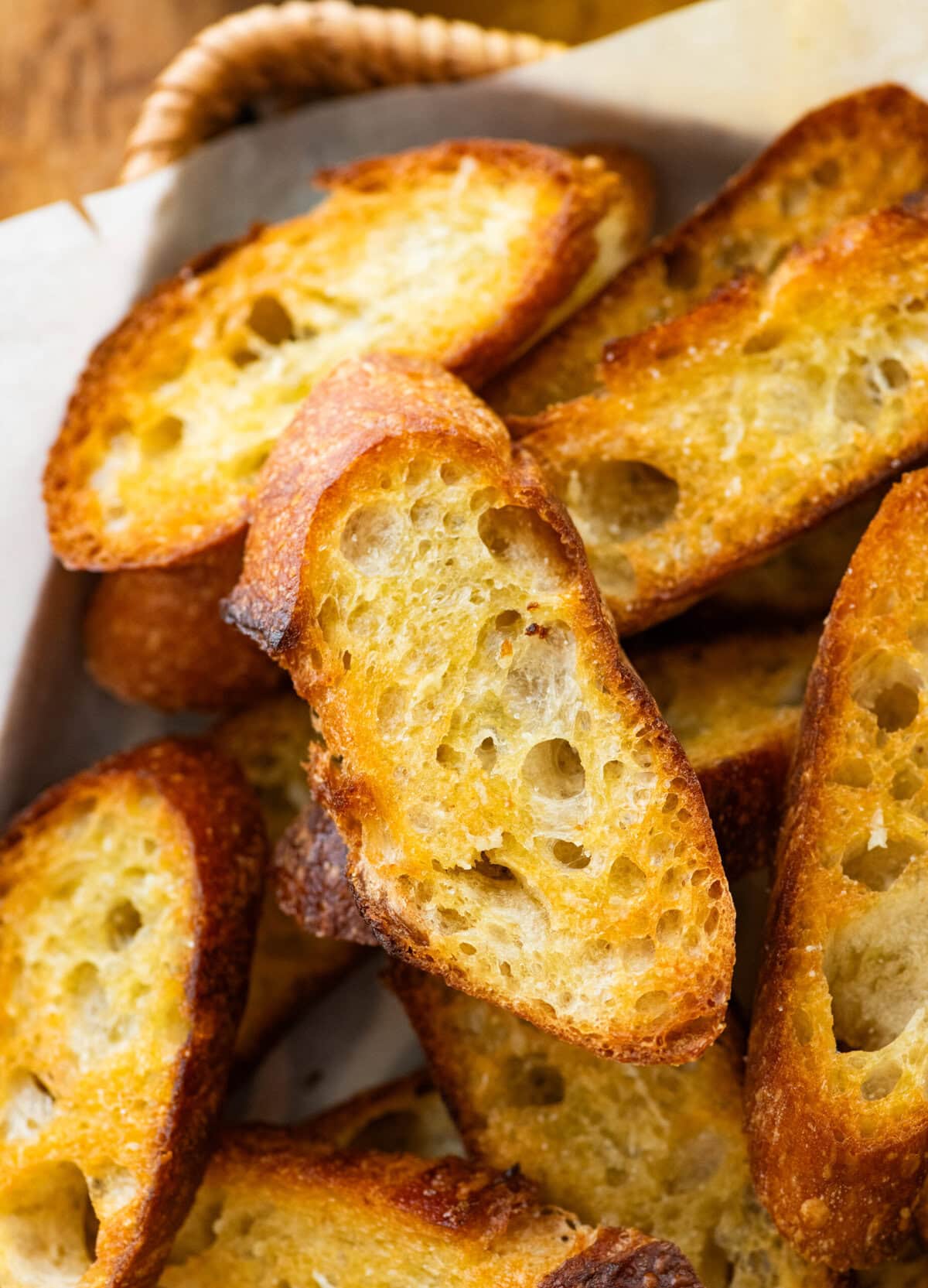 A pile of crostini on a tray.