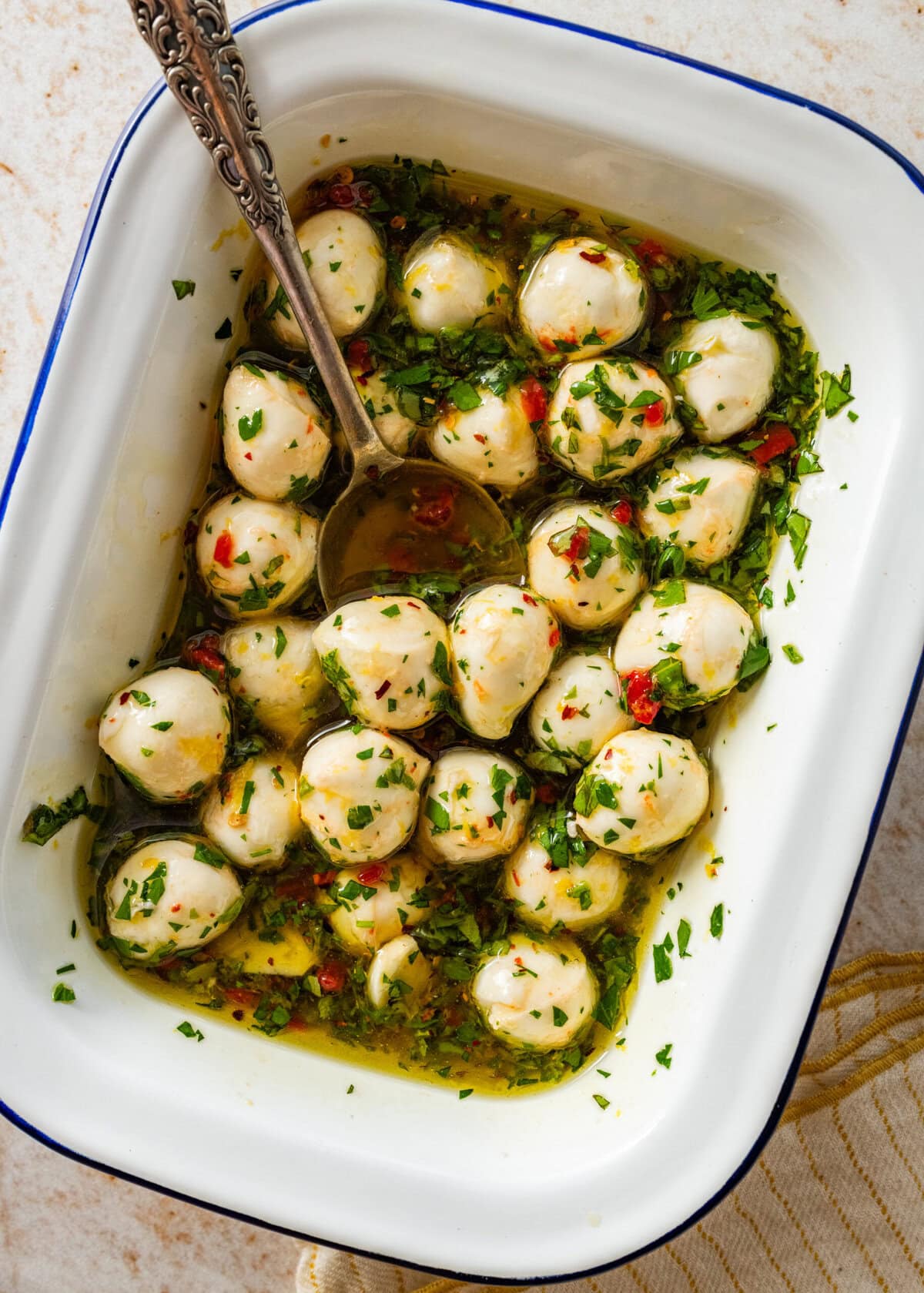 After mixing the mozzarella balls and marinade ingredients.