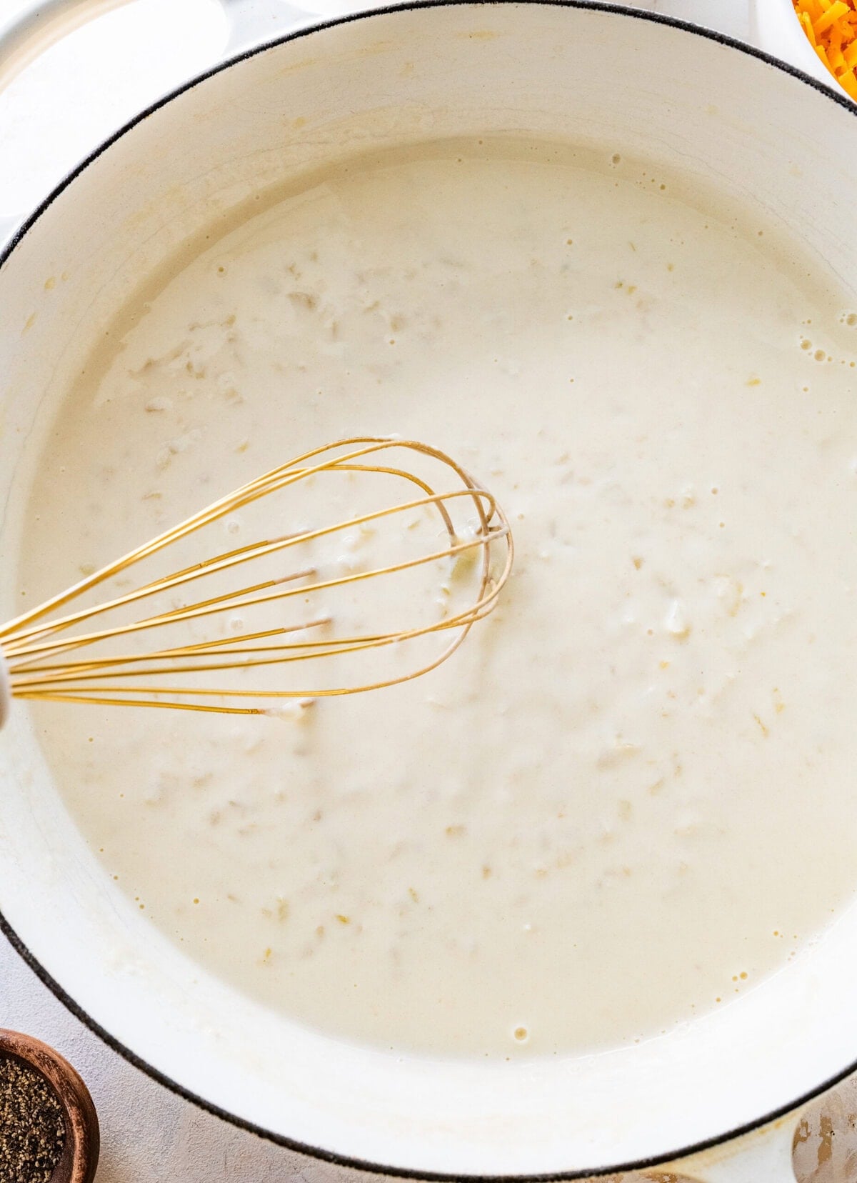 The roux for the party potatoes in a pot.