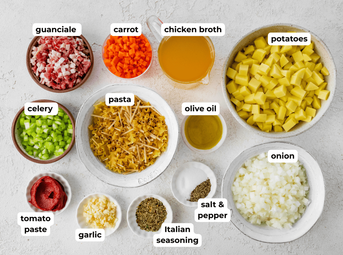 Ingredients to make pasta e patate in separate bowls.