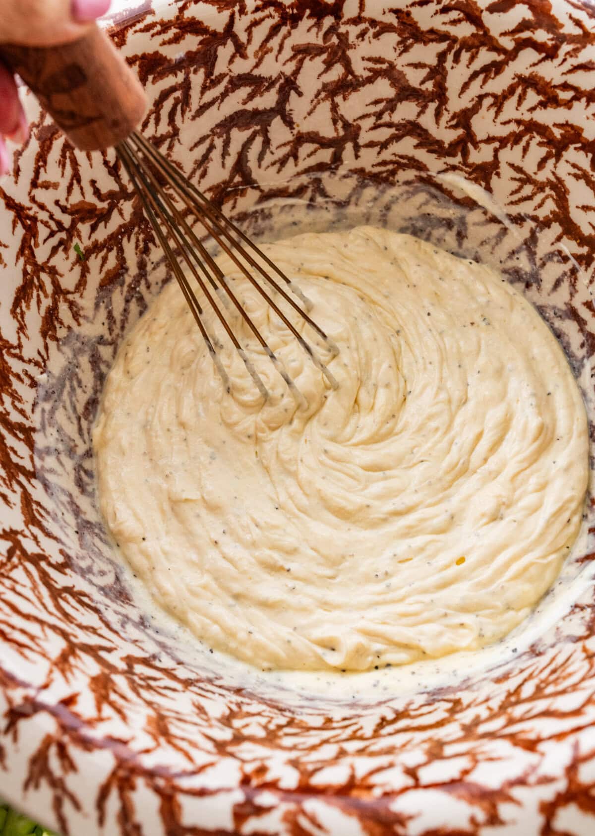 Dressing ingredients in a bowl after combining.