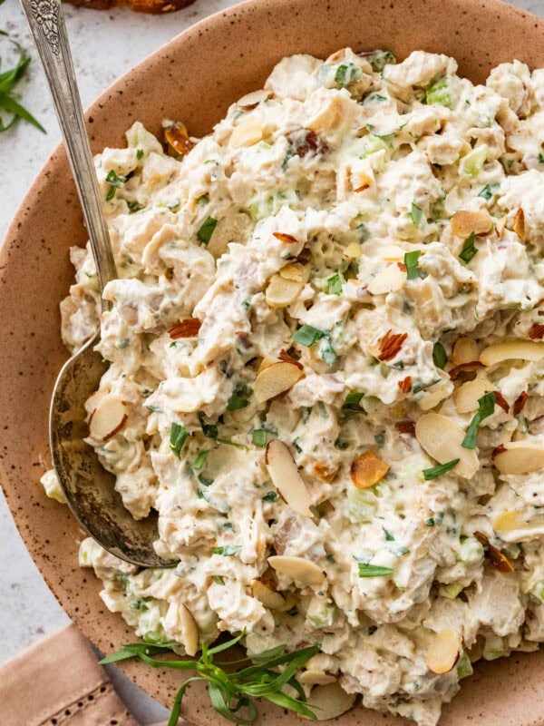 Tarragon chicken salad in a bowl with a serving spoon.