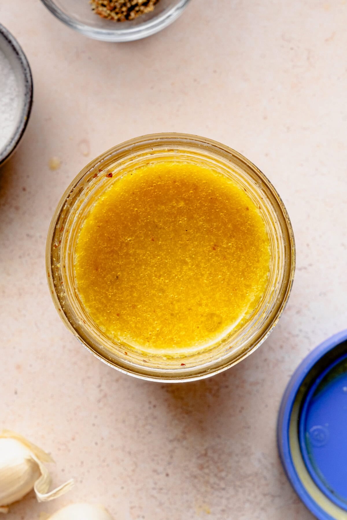 Jar of the apple cider vinegar dressing after combining.