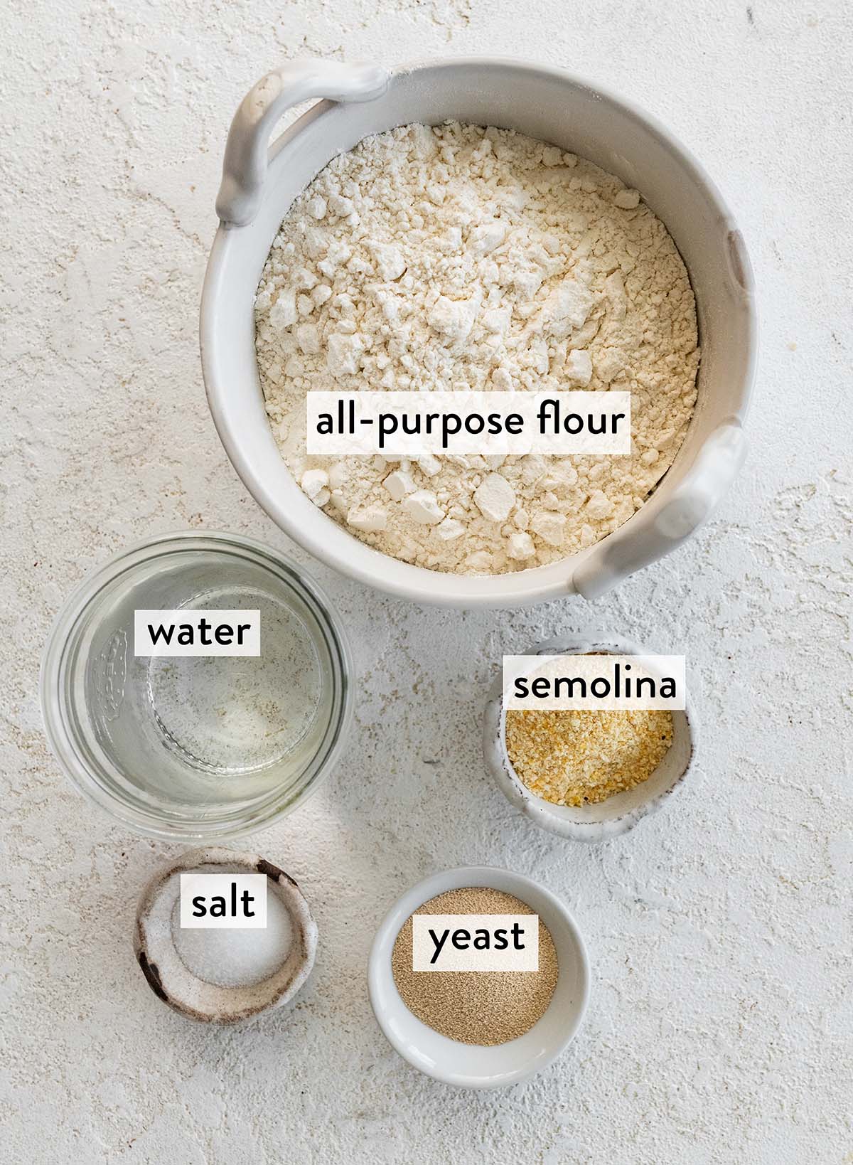 bowls of ingredients for ciabatta bread.