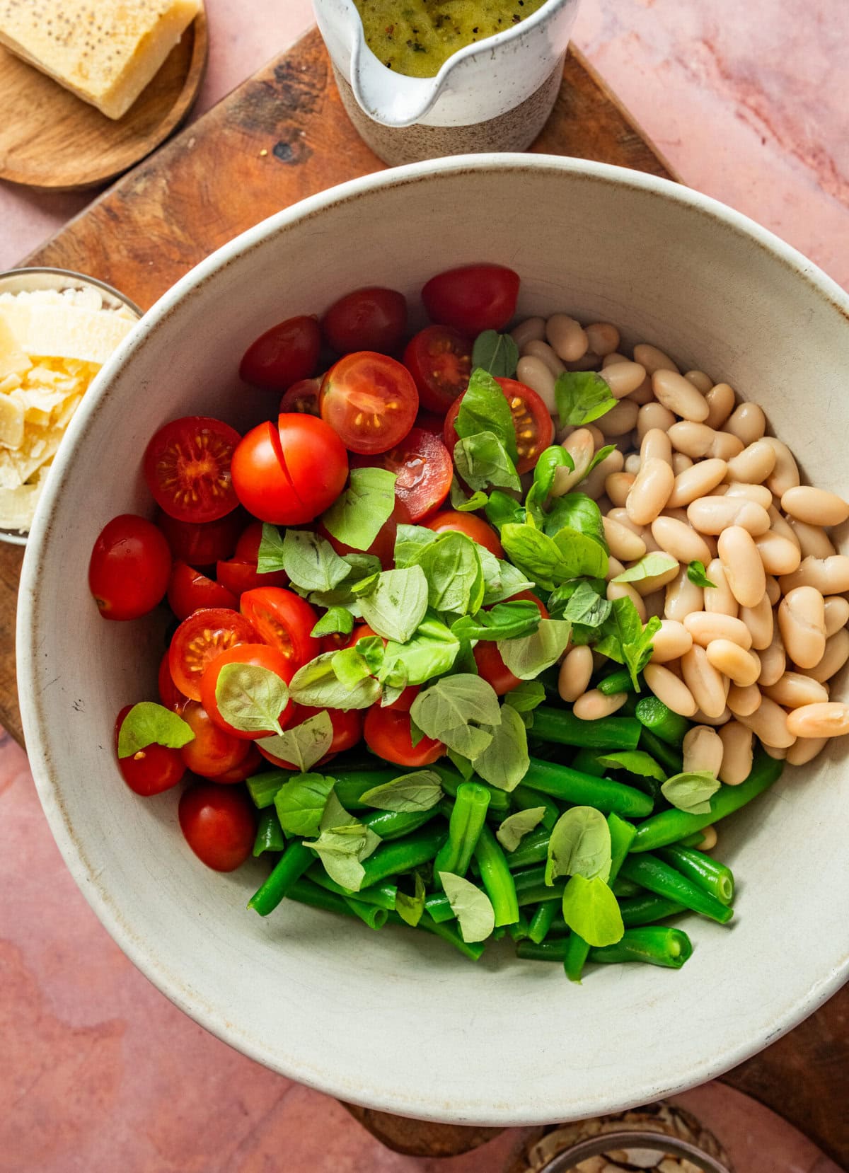Ingredients for the green bean salad in a bowl before combining or adding dressing.