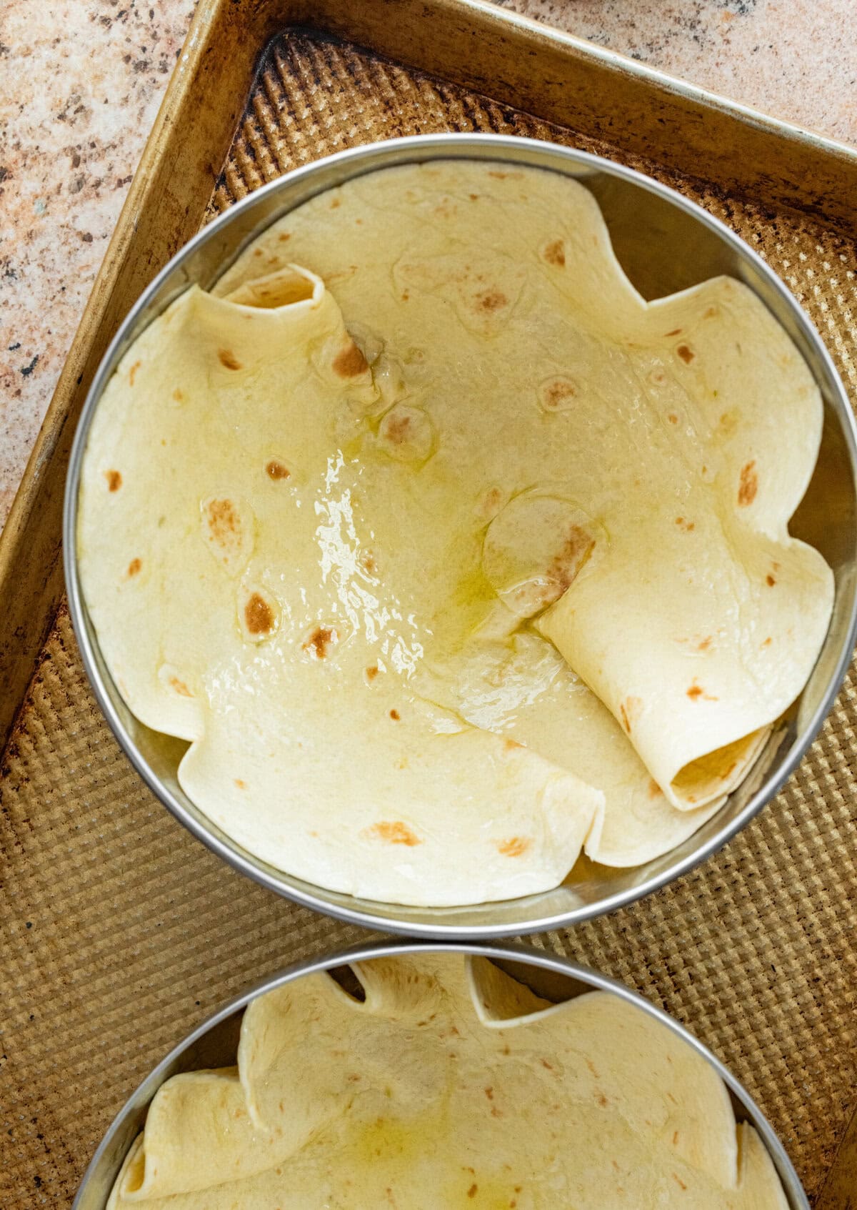 Tortillas placed inside bowls.