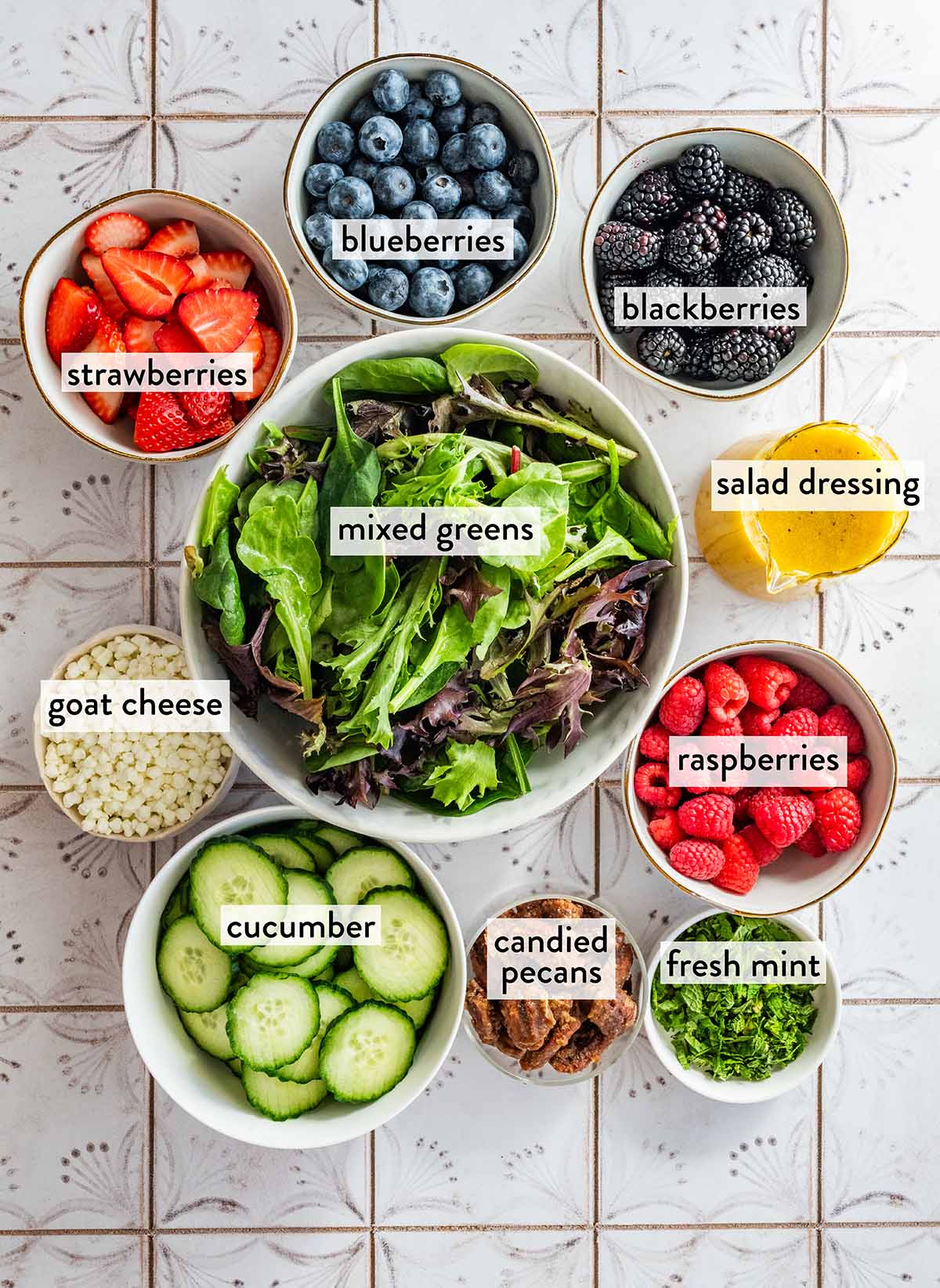 bowl of ingredients for berry goat cheese salad.