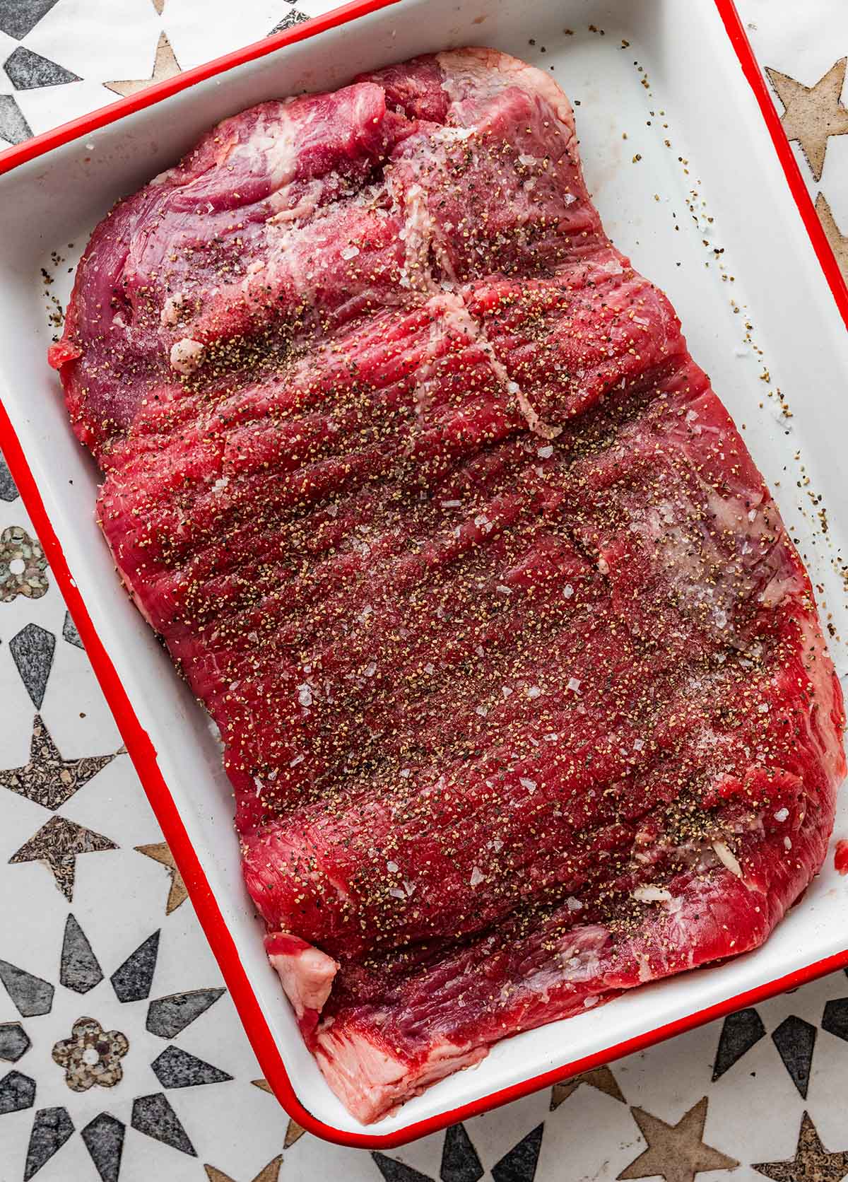 flank steak seasoned with salt and pepper.