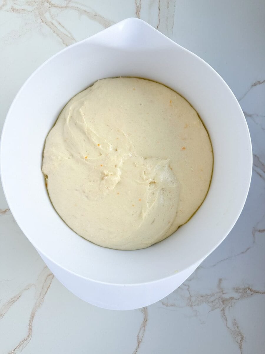 Proofed zeppole dough in a bowl.