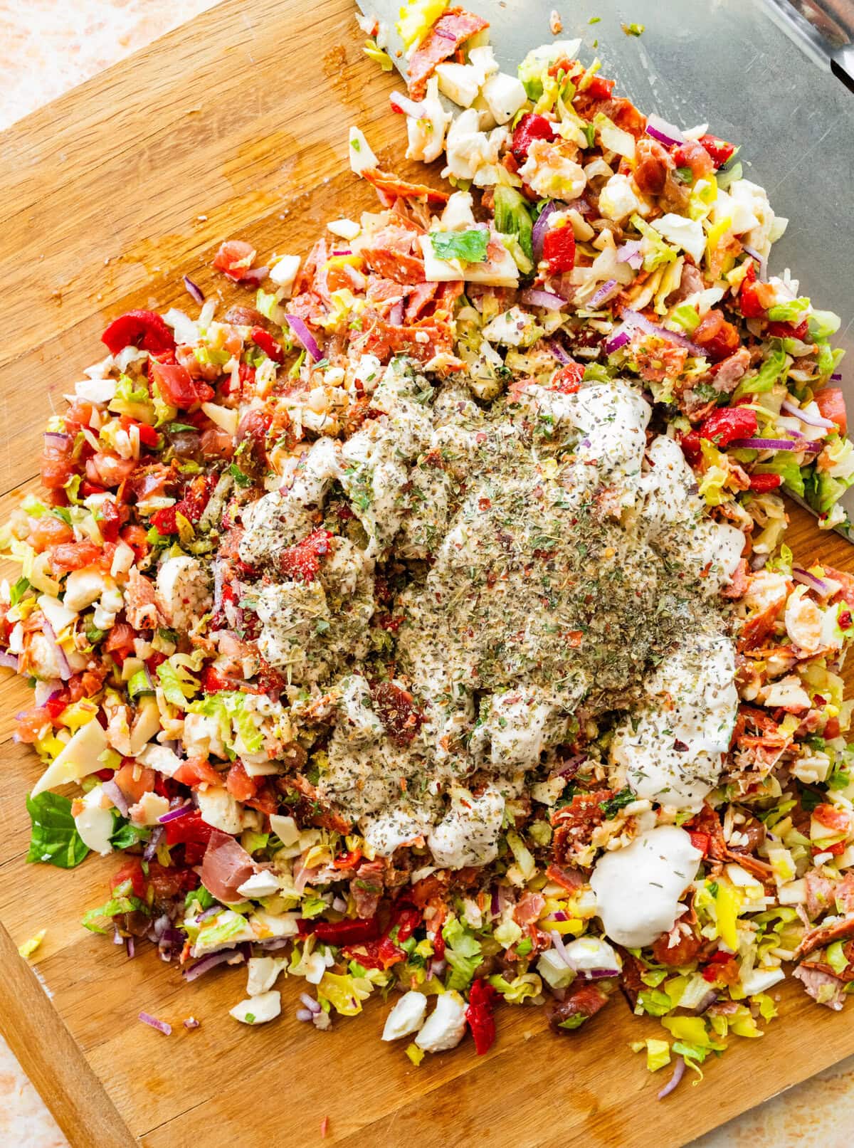 the seasonings added on top of the cut ingredients on the cutting board.