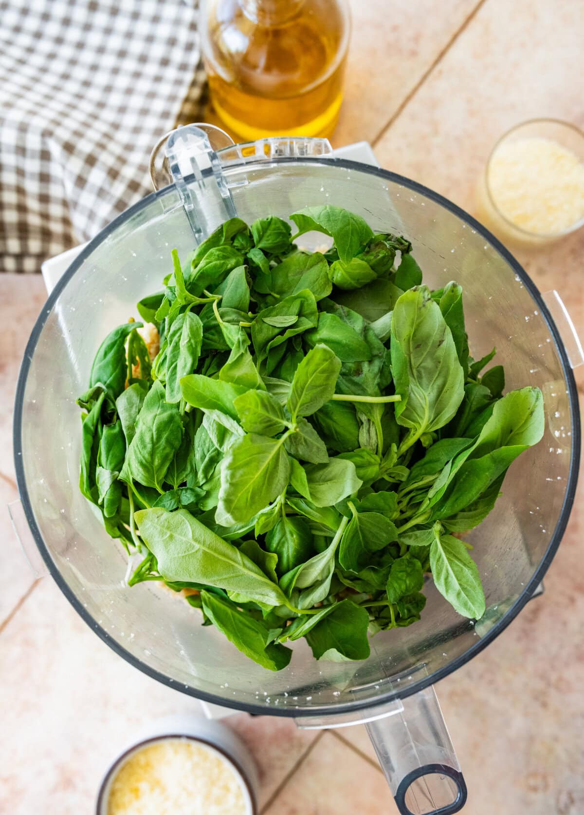 fresh basil added to the food processor.