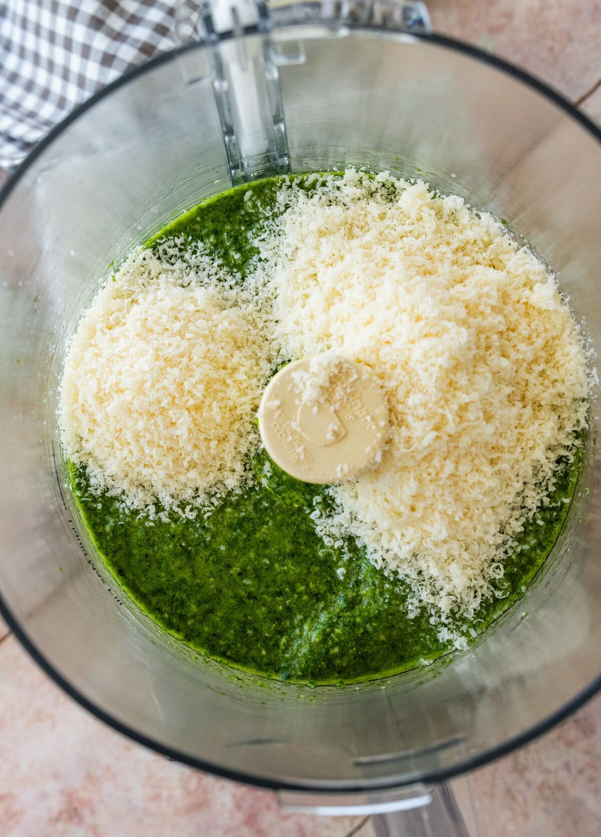 the cheeses added on top of the pulsed basil pesto.