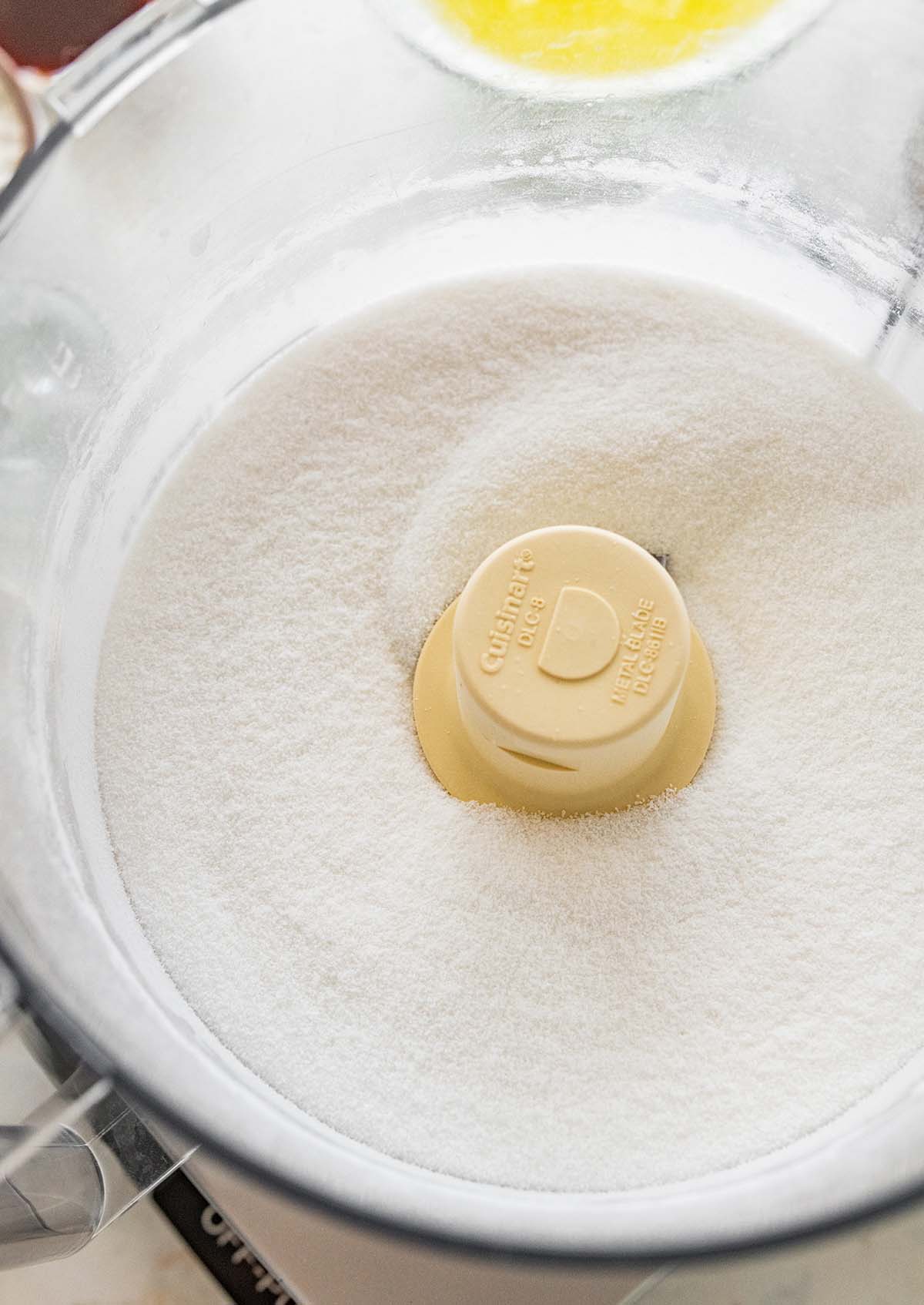 pulsing granulated sugar in a food processor.