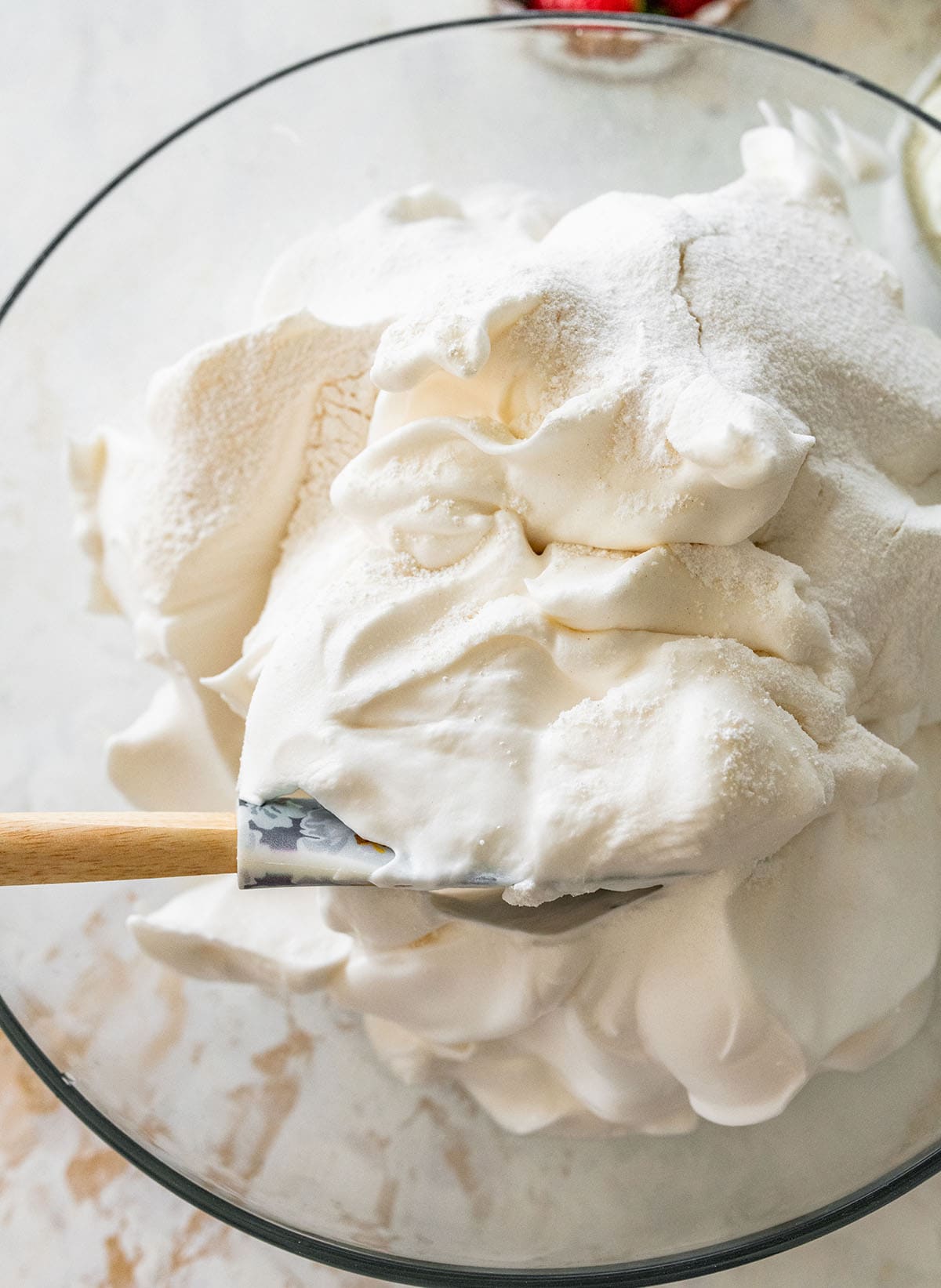 folding dry ingredients into the beaten egg whites.
