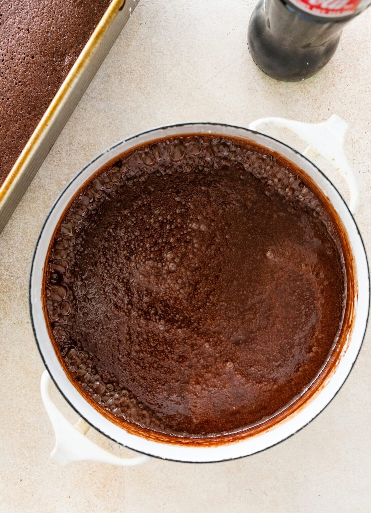 Coca cola cake in a cake pan after removing from the oven.