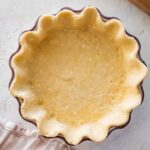 pastry in a deep, fluted-edge pie dish.