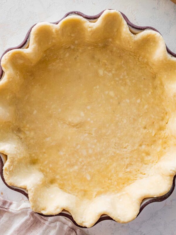pastry in a deep, fluted-edge pie dish.