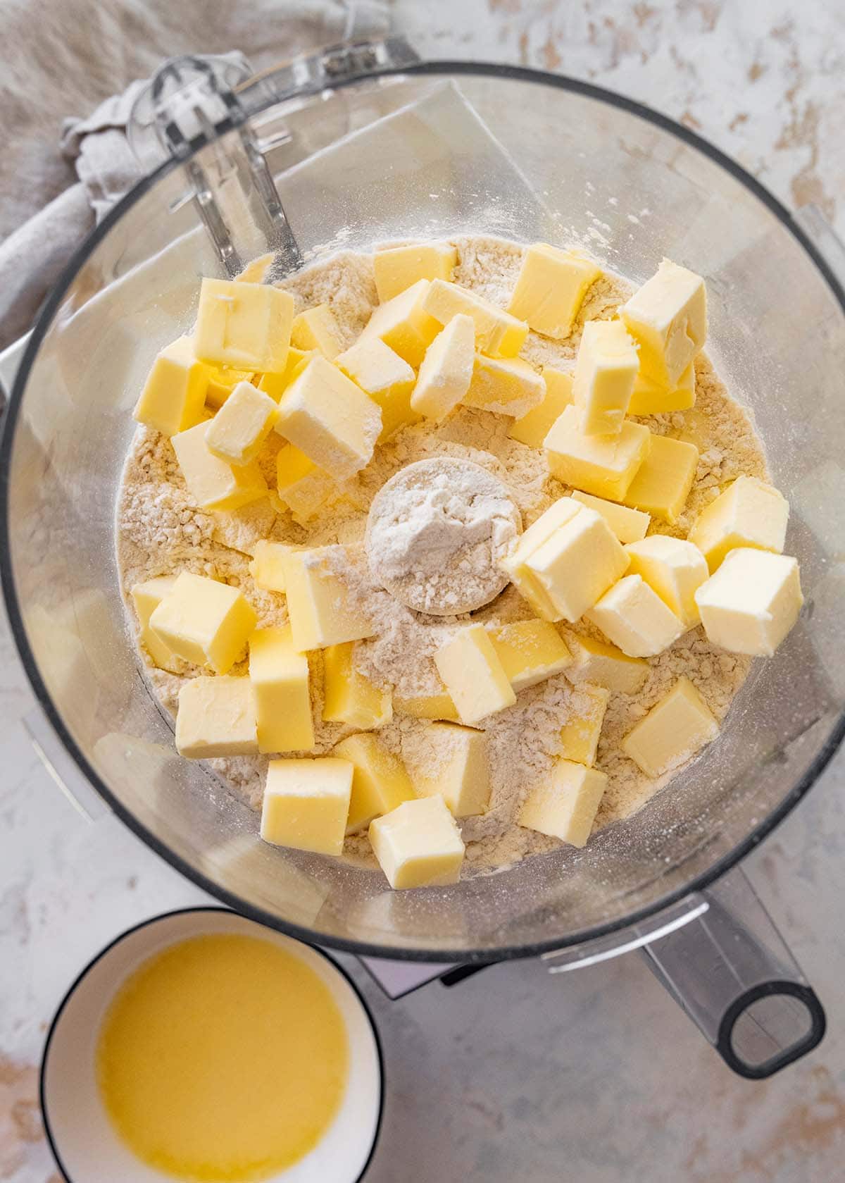 flour, salt, and cubed butter in the barrel of a food processor.
