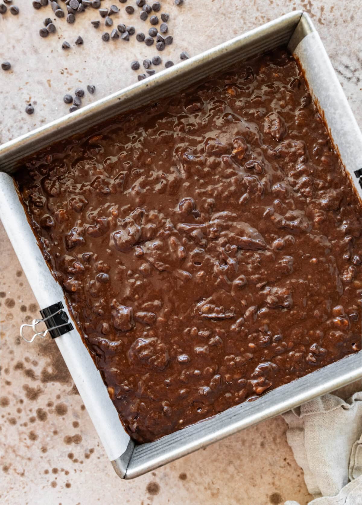 Brownie batter in a pan, smoothed to make it even.