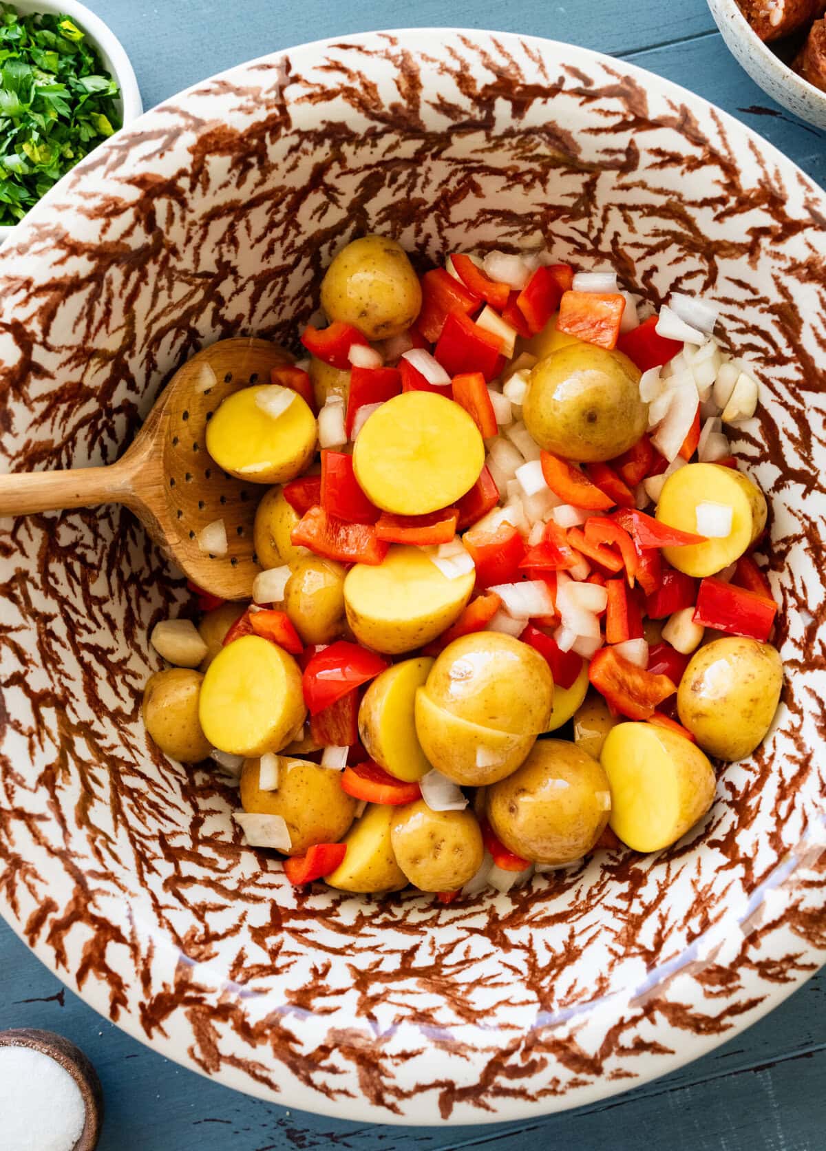 The bowl of veggies after stirring with the olive oil.