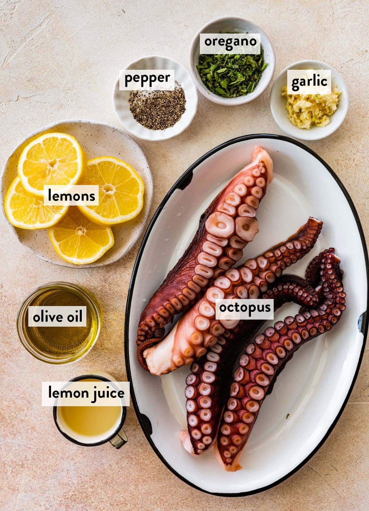bowls of ingredients for grilled octopus on a white counter.
